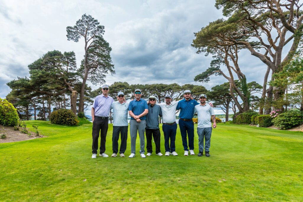 Seven golfers standing together on a course in Killarney, Ireland